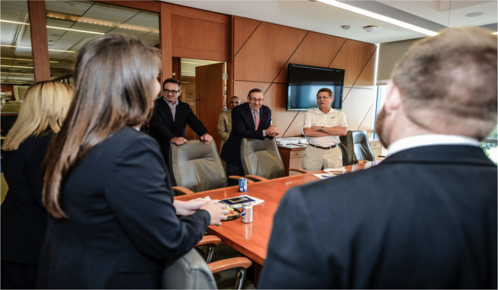 University of Michigan Ross School of Business MBA students meet with Miami Dolphins executives Tom Garfinkel, president and CEO, Stephen M. Ross, chairman, and Dan Caspersen, senior vice president of human resources, during their project this spring to create Miami Dolphins University for the NFL team. Photo by Angel Valentin.