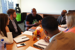 rsity of Michigan Ross School MBA students interview 2014 first-round NFL draft pick and Miami Dolphins offensive tackle Ja’Wuan James (center) at the team’s training facility. Pictured from left are Alexa Likens, Jeffrey Gross, C.J. Azubuine, John Thompson, Aimee Grimshaw and Darryl Tricksey. Photo by Angel Valentin.