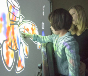 U-M students in engineering and architecture collaborate to create playscapes for children with autism. (Photo by Sean Ahlquist)