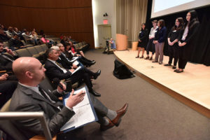 Judges ask questions of the Honey team, a group focused on reproductive health for women. 