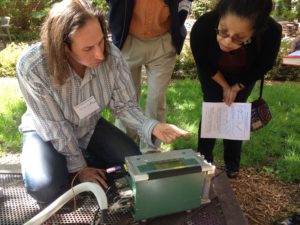  Jim LeMoine, research laboratory specialist associate, shows Addell Austin Anderson, director of the University of Michigan Detroit Center, carbon dioxide readings from the soil outside of the Michigan League. Leaders from the U-M Biological Station took faculty and staff outdoors to participate in an abbreviated experiment much like the ones students experience. 