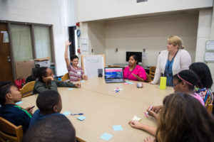 U-M interns lead students in a discussion about appropriate online behavior. Pictured: Jalen Aquino, Ajahne Roper, U-M Intern Cristal Lugo, U-M Intern Amanda Kortz, Jordan Cline, Navaeh Kendricks and Kala Jones.