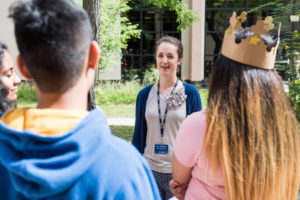 U-M intern Clare Williams leads students in an activity.