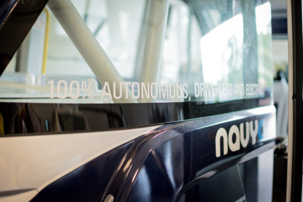 A close up of the shuttle's window reveals the text, "100% autonomous".