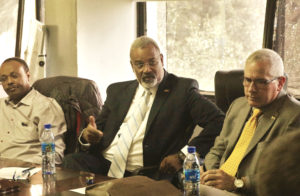 Provost Martin Philbert converses at a conference table