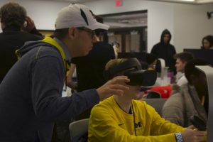 Students operate Oculus Rift headsets to operate virtual cameras and reshoot the scene