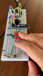 A circuit with an electronic device saying calculating wired in. 